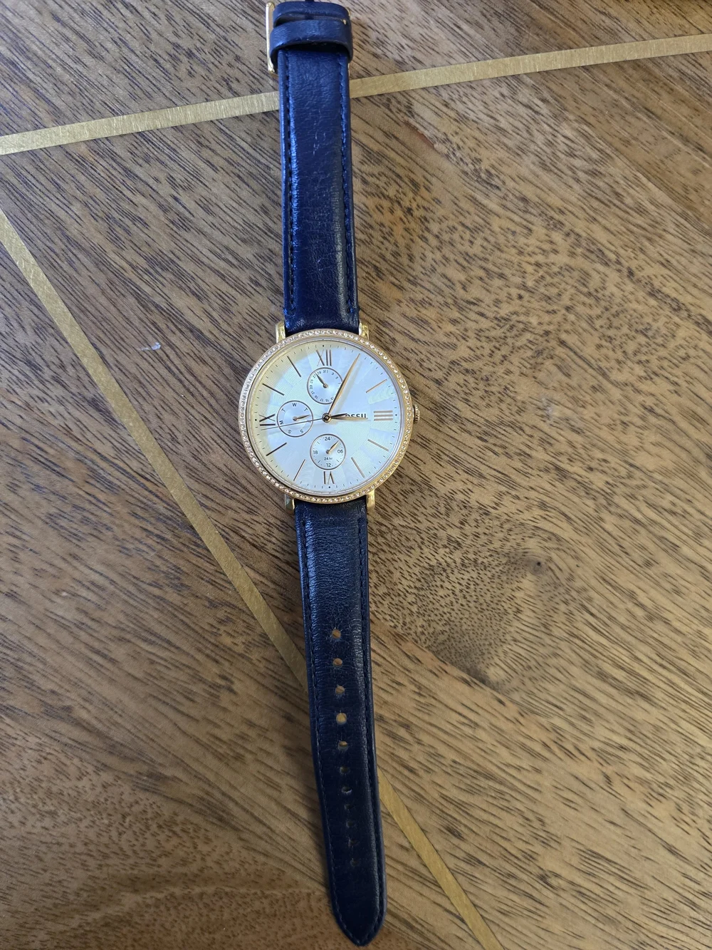 Fossil Gold-Tone Case Watch with White Dial and Black Leather Strap